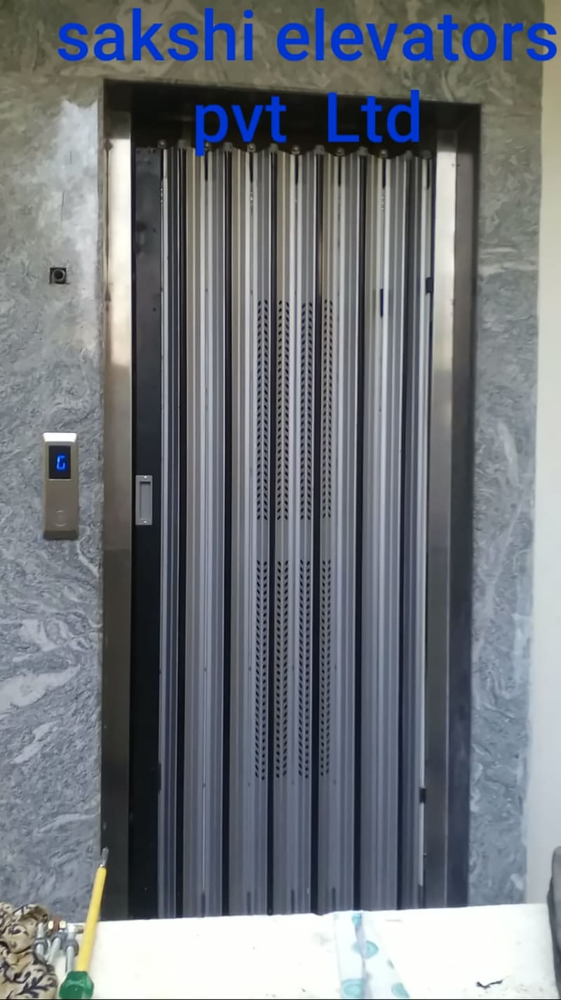 Stainless steel collapsible lift door with a floor call button
