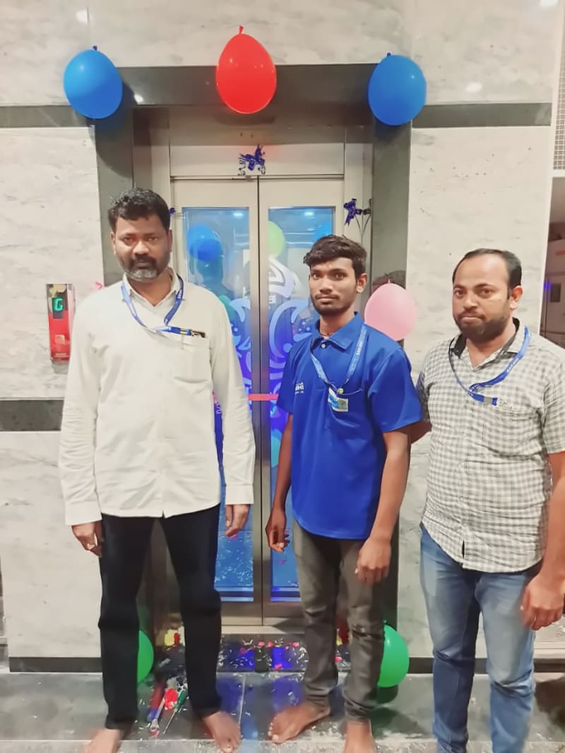 Sakshi Elevators owner with customers at a newly handed-over lift decorated with balloons